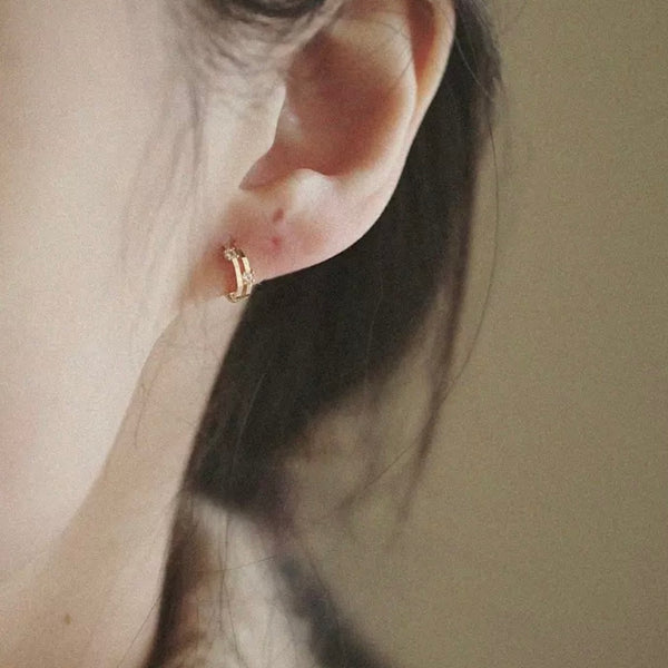 Boucles d’oreilles créoles DVA or jaune et cristaux blancs